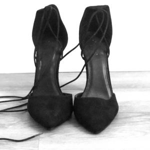 Black heel with lace that goes up the leg